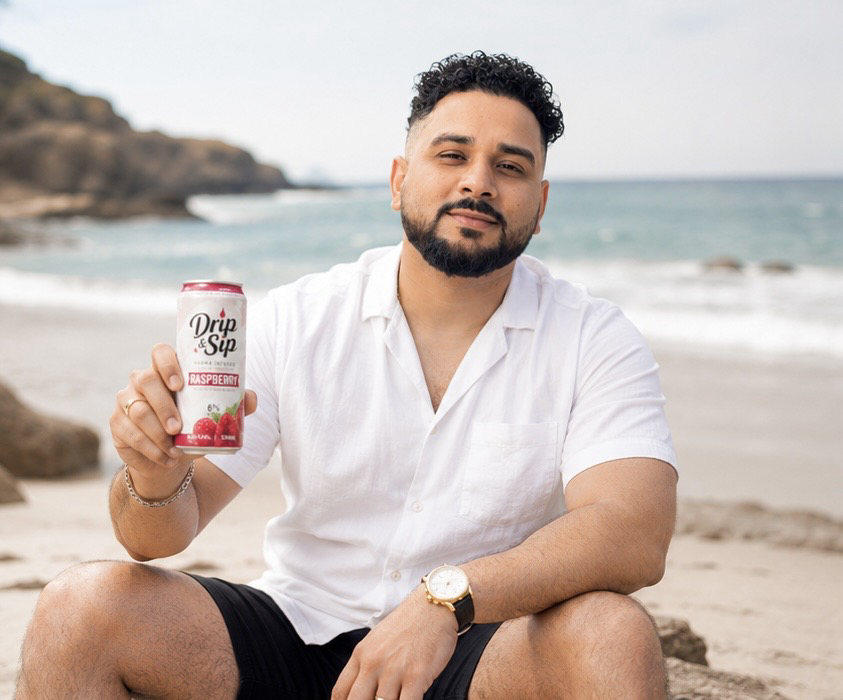 Founder holding Drip & Sip Raspberry
